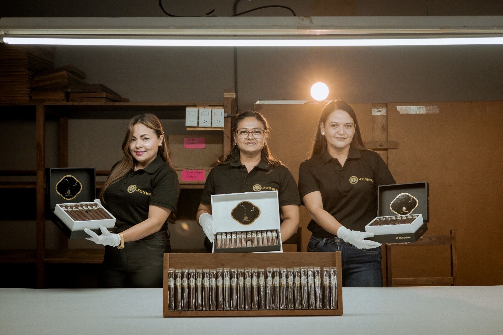 The H Junior team presenting their cigar boxes